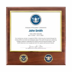 brown certificate plaque with 2 coins featured below certificate window